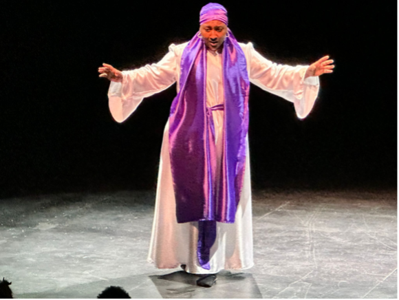 A performer in The Journey.