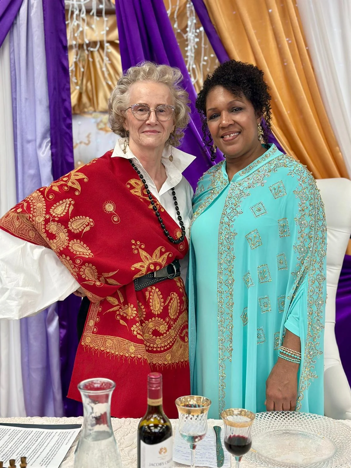 Two members of the congregation smiling together.