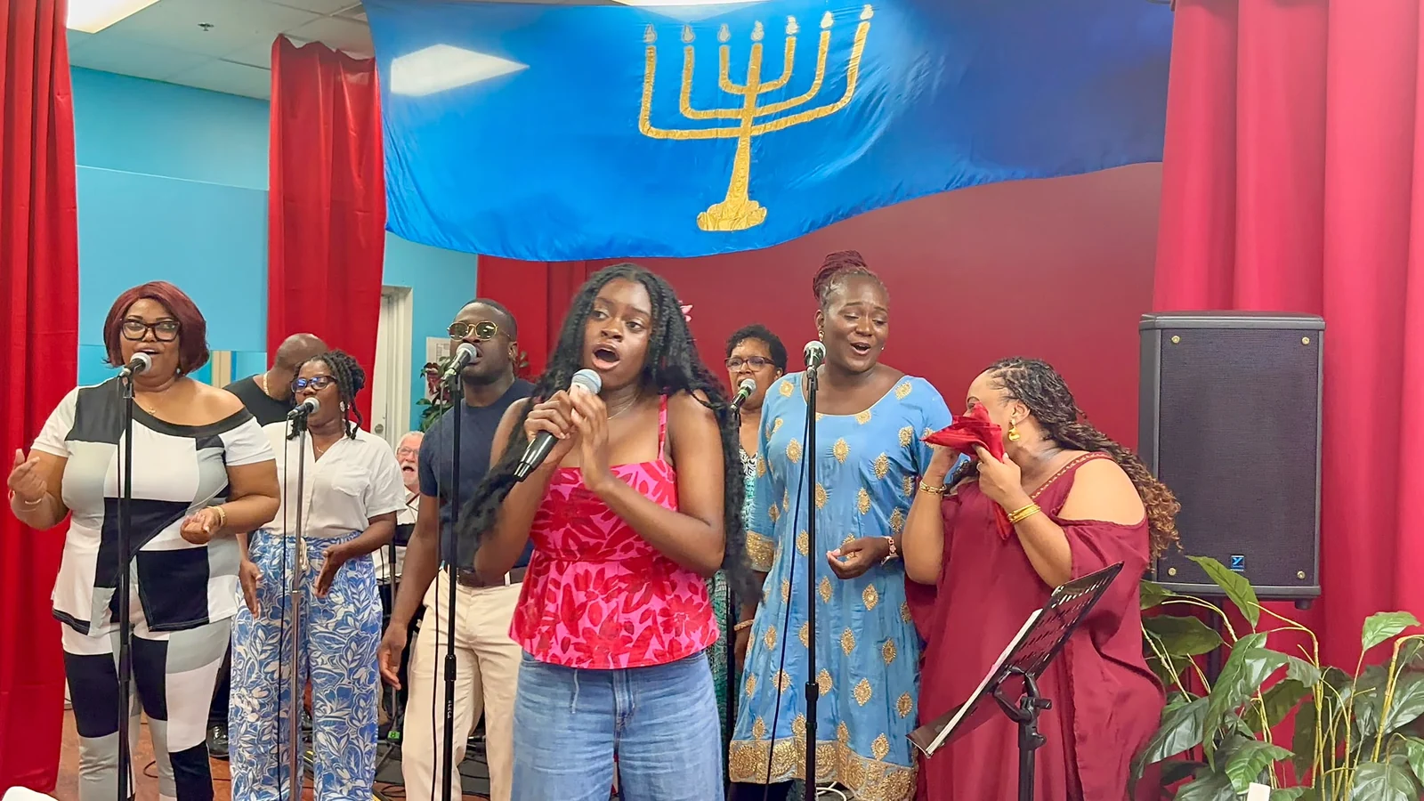 Singers performing together with microphones.